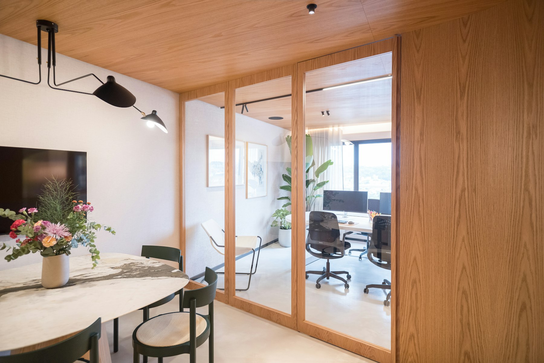 Modern commercial office interior with glass partitions