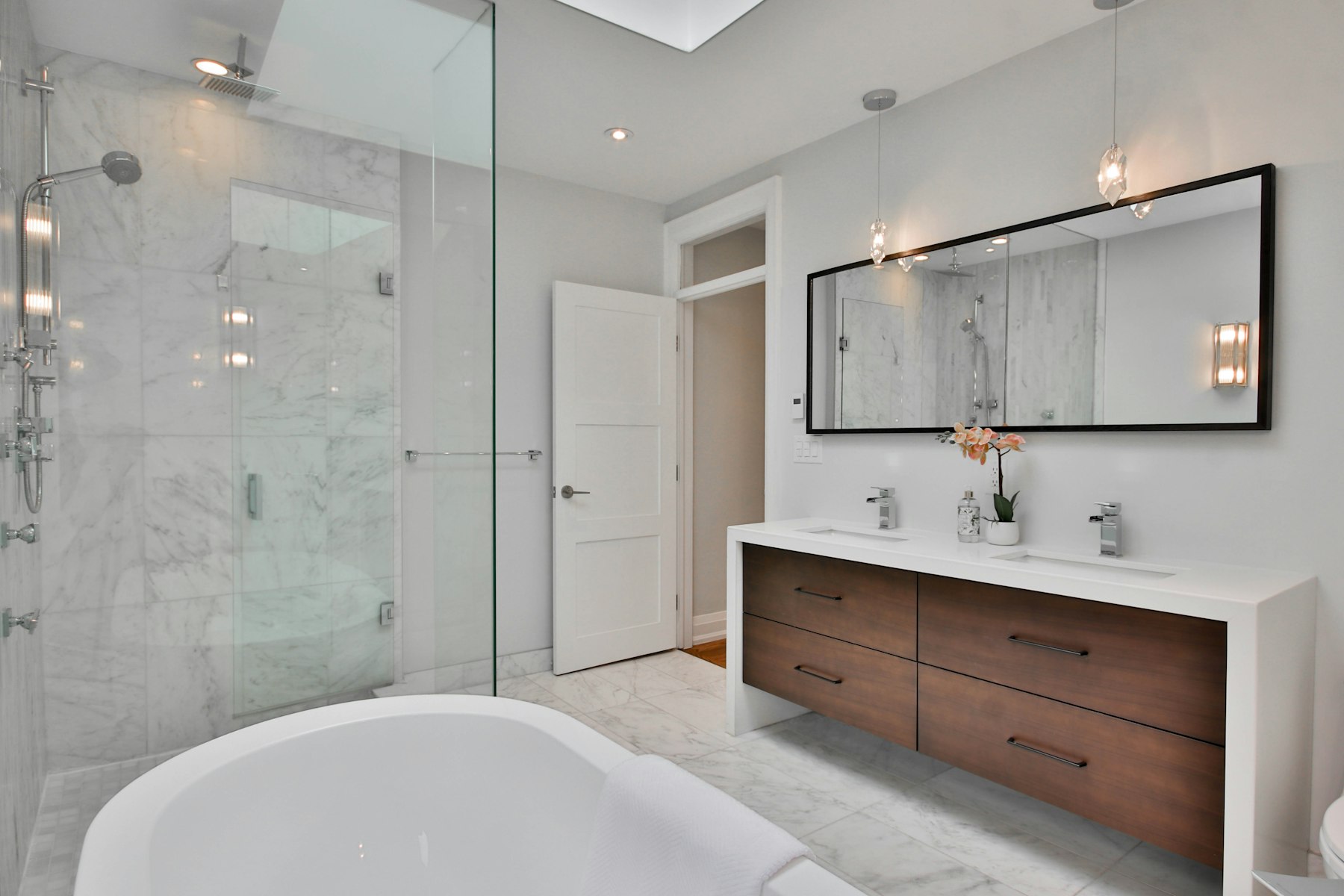 Premium residential bathroom with freestanding bath and walk-in shower